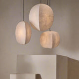 Kumo Linen Pendant — cluster over a plinth