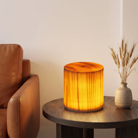 Grove Cube Lamp — cylinder on oak side table beside leather armchair