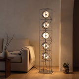 Orbit Bauhaus Floor Lamp — Silver beside turntable console