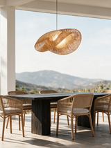 Wave Rattan Pendant Light — patio dining lifestyle