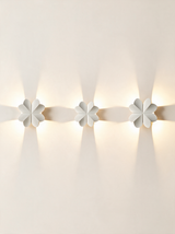 Aurelia Silhouette Wall Sconce - hero product shot (four-leaf clover, white)