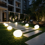 Pebble Glow Landscape Light - lifestyle image pathway at night