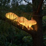 Woodland Squirrel Solar Light - lifestyle image mounted on tree trunk at dusk