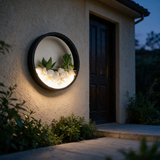 Oasis Ring Wall Planter Light - lifestyle image stucco wall by front door at dusk