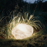Boulder Glow Landscape Light - lifestyle image flower bed at dusk