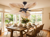 Palm leaf ceiling fan above dining area