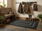 Dirt-trapper mat in a mudroom