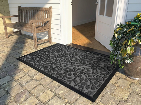 Polyester outdoor door mat on a covered front porch
