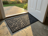 Polyester outdoor door mat at a back door