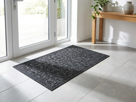 Polyester outdoor door mat at a modern entryway