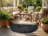 Outdoor rug on a covered patio with lounge furniture