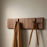 Modern Nordic Walnut Coat Rack — angled view on greige wall