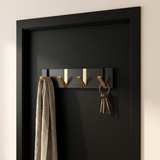 Foldable Wall Hook Rack — mounted on a matte black door