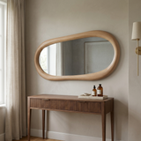 Modern Irregular Wall Mirror with Wooden Frame — above a fluted walnut vanity