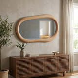 Modern Irregular Wall Mirror with Wooden Frame — above a slatted walnut sideboard