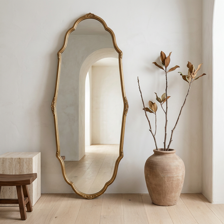 Vintage Full-Length Wall Mirror, French-Inspired — beside magnolia branches on a travertine plinth