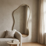 Modern Irregular Floor Mirror, Gold Metal Frame — beside linen curtains