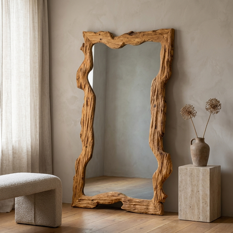 Rustic Solid Wood Mirror, Raw-Cut Pine — hero, leaning against a plaster wall