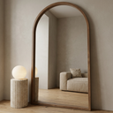 Elegant Arch Full Length Floor Mirror, Ash Wood — hero in walnut with alabaster lamp