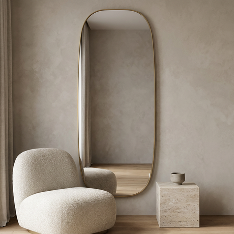 Modern Oval Full Length Wall Mirror, Slim Brass Frame — hero with a bouclé chair