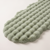 Plush Faux Fur Runner Rug — Green, full view on off-white backdrop