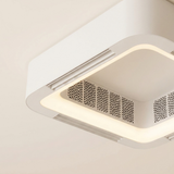 Close detail of the enclosed perforated grille and LED edge band