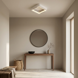 Bladeless flush mount ceiling fan in a bright entryway