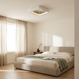 Bladeless flush mount ceiling fan in a calm minimalist bedroom