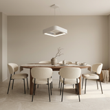 Bladeless ceiling fan pendant above a walnut dining table