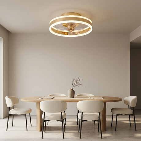 Gold flush mount ceiling fan in an elegant dining room