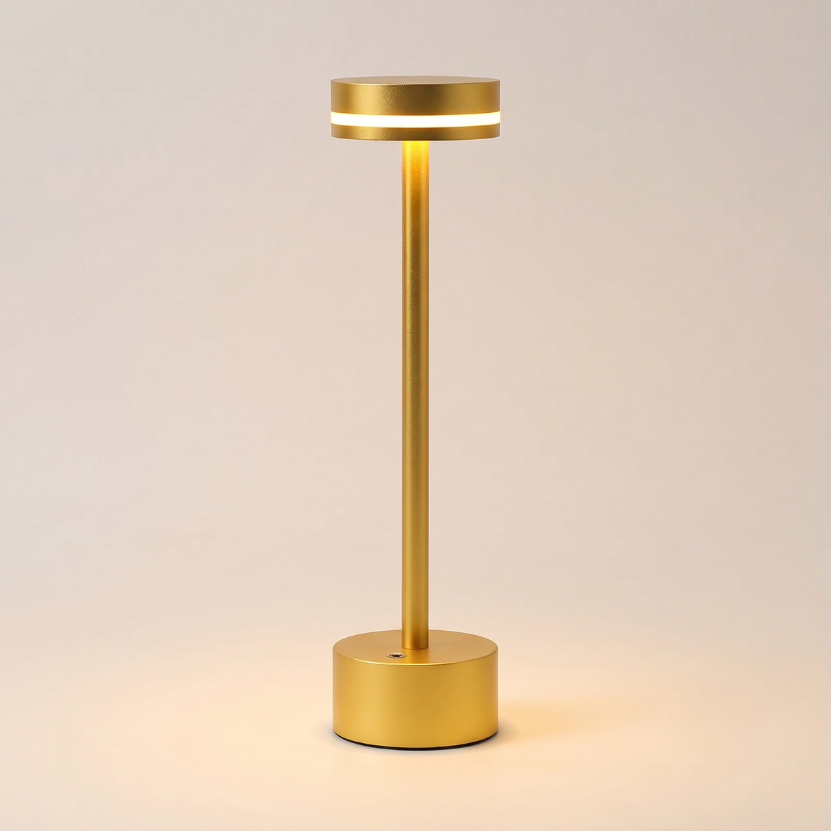 Drift Aluminum Table Lamp — Gold, switched on