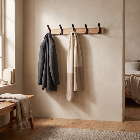 Nordby Adjustable Coat Rack — in a bedroom corner with jacket and scarf