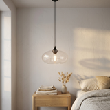 Tidewell Glass Pendant — lit at dusk