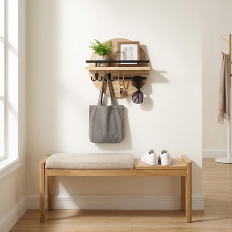 Round Wall Organizer in Beige/Black above an oak shoe bench