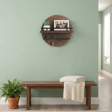 Round Wall Organizer in Brown/Black above a walnut hallway bench
