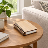Lumibook Foldable Table Lamp — closed on a side table in daylight, lamp off
