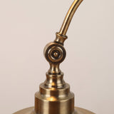 Antique Brass Gooseneck Desk Lamp - close-up of the brass swivel joint and stepped base