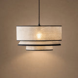 Sable tiered fabric pendant light with three beige tiers and black trim