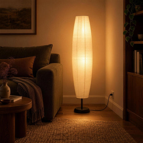 Sora Rice Paper Floor Lamp — reading corner in the evening, lamp on